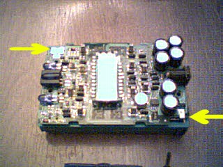 Lego RCX Main board. Arrows Indicate battery contacts