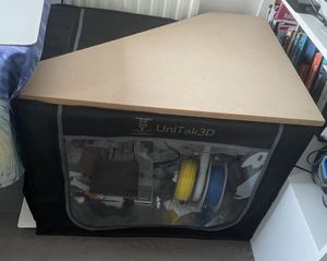 The enclosure back in its usual spot, with the printer running inside on its new frame