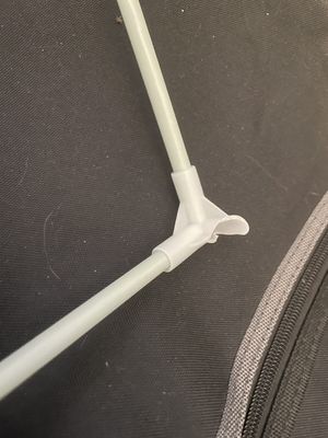 Closeup of a snapped plastic corner joint with a fibreglass rod