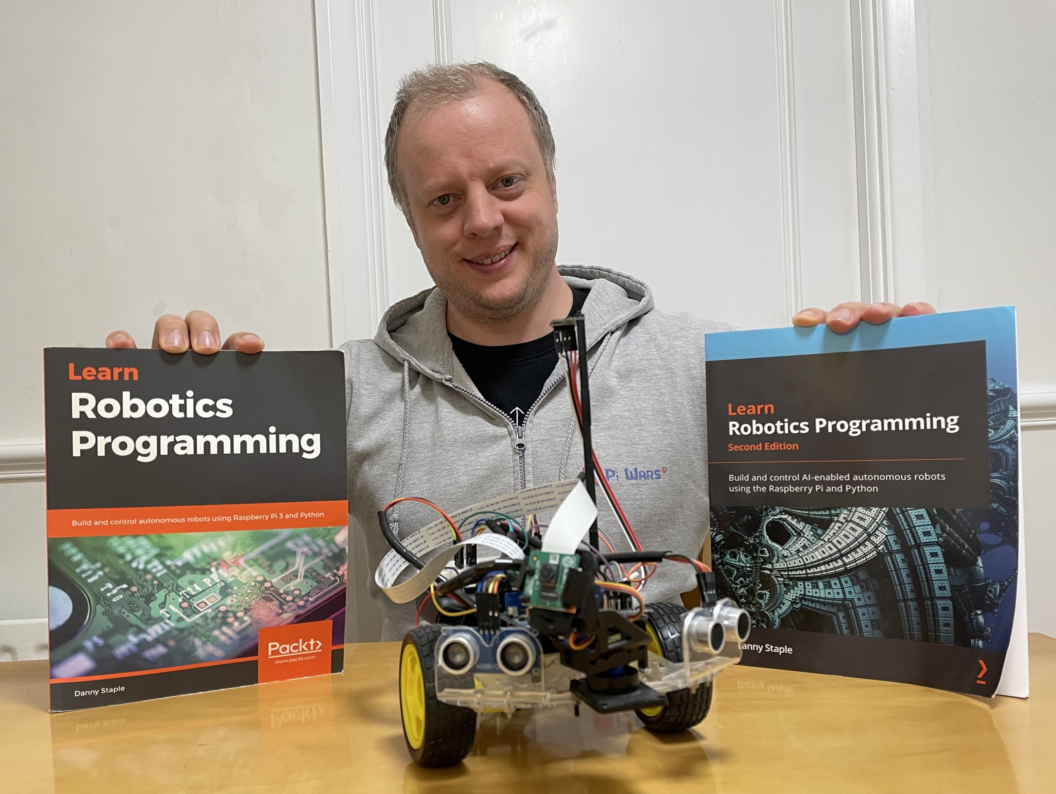 Danny pictured with the Learn Robotics Programming books